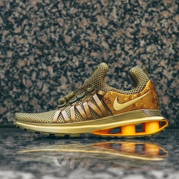 Nike Shoes - Nike Shox Gravity Women's Shoe Metallic Gold